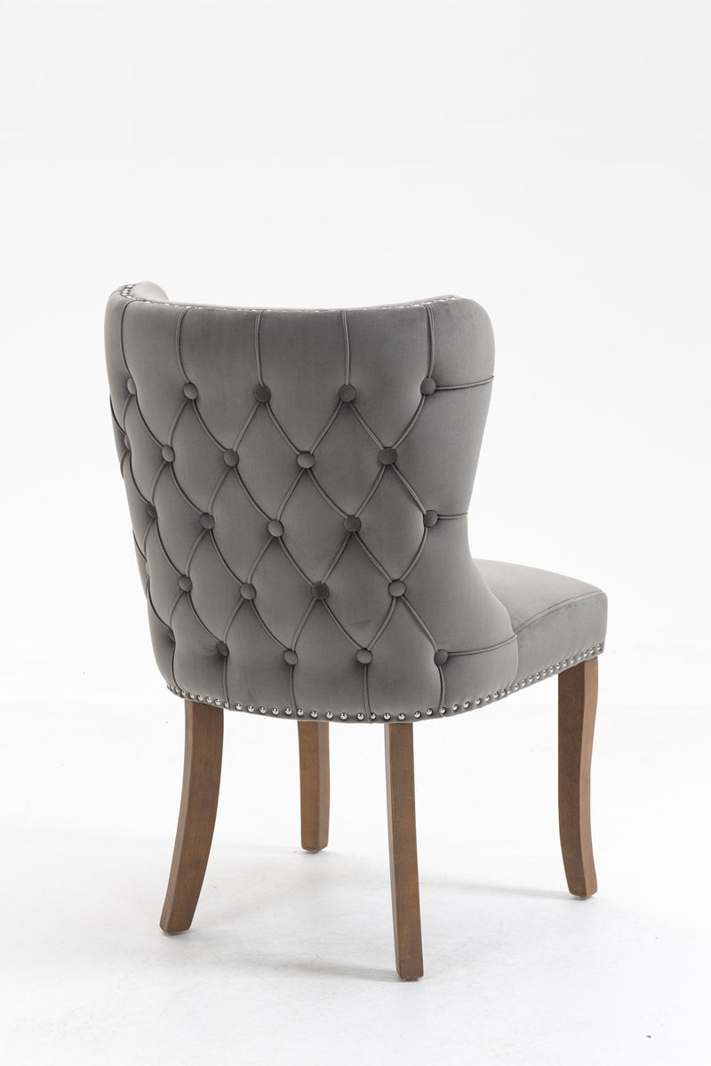 Set of 2 upholstered wing-back dining chair with backstitching nailhead trim and solid wood legs